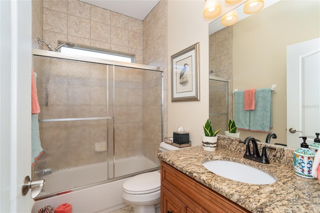 full bathroom with shower / bath combination with glass door, toilet, and vanity