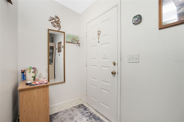 entryway featuring light tile patterned flooring