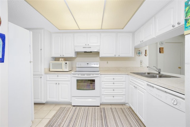 kitchen featuring white cabinetry, white appliances, and sink