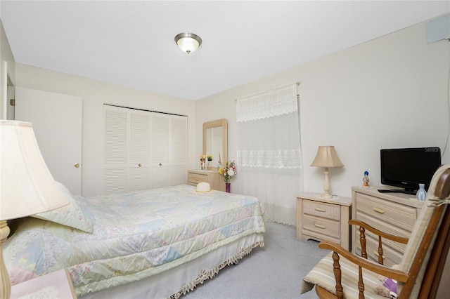 carpeted bedroom featuring a closet