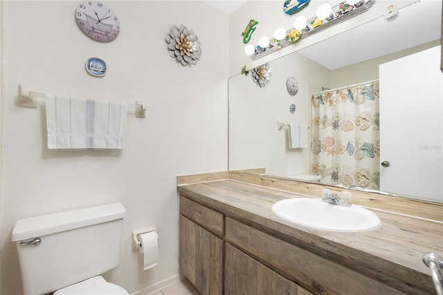 bathroom featuring toilet, vanity, and walk in shower