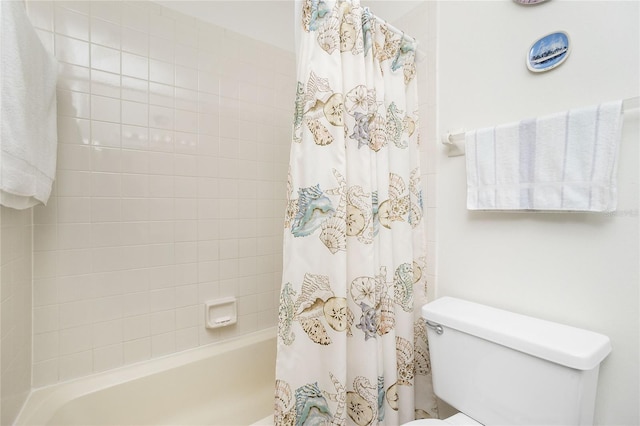 bathroom with toilet and shower / tub combo with curtain