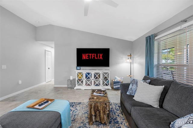 living room with ceiling fan, carpet floors, and vaulted ceiling