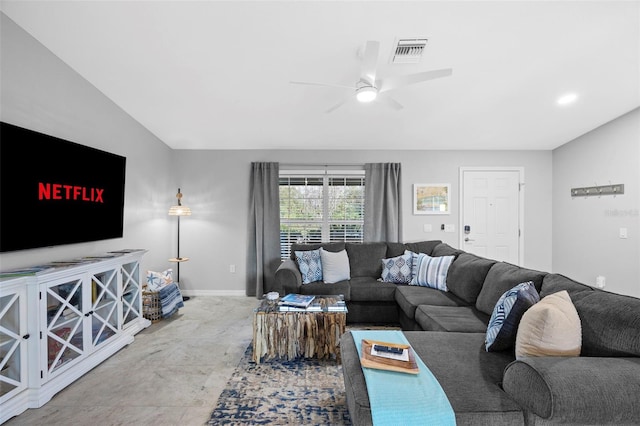 living room with ceiling fan and lofted ceiling