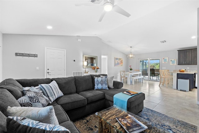 living room featuring light tile patterned floors, vaulted ceiling, and ceiling fan