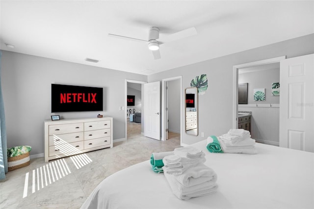 bedroom featuring ensuite bathroom and ceiling fan