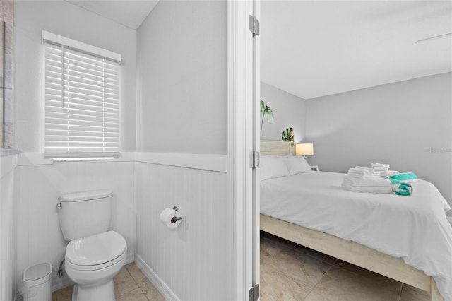 bathroom with tile patterned floors and toilet