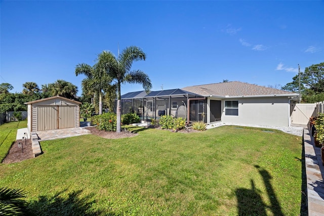 view of yard featuring a lanai and a storage shed