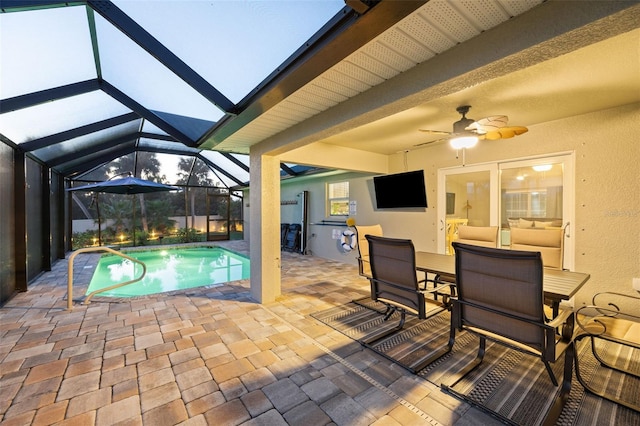 view of pool with a lanai, a patio area, and ceiling fan