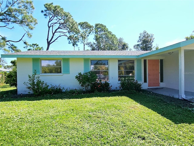 ranch-style house with a front yard