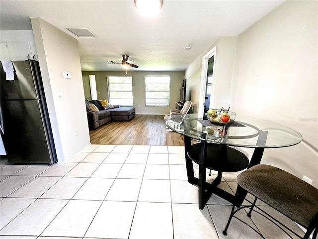 dining room featuring ceiling fan and light hardwood / wood-style floors