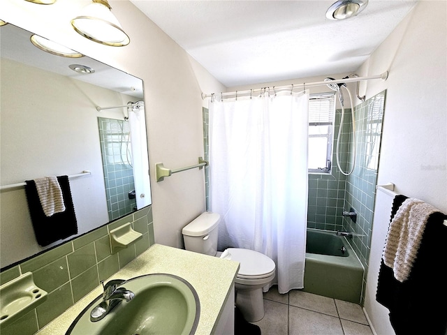 full bathroom featuring tile patterned floors, vanity, toilet, decorative backsplash, and shower / tub combo with curtain