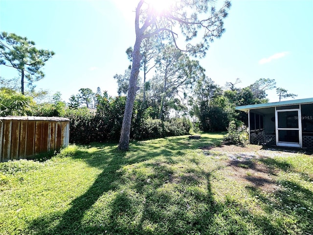 view of yard featuring a sunroom