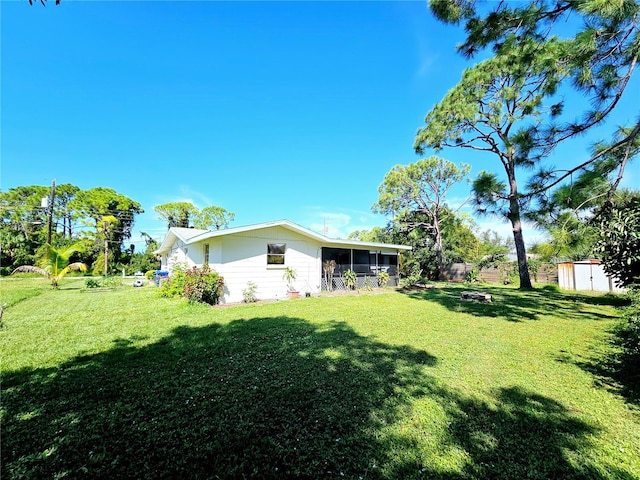 view of yard with a sunroom