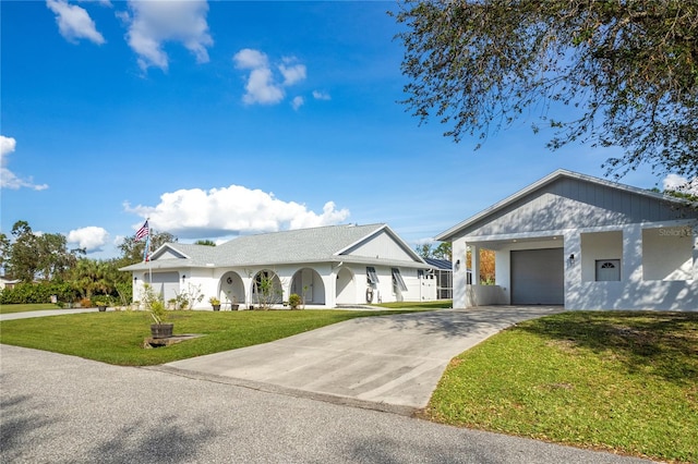 view of front of property featuring a garage and a front yard