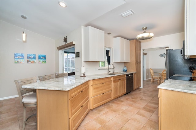 kitchen with white cabinetry, pendant lighting, a kitchen breakfast bar, dishwasher, and kitchen peninsula