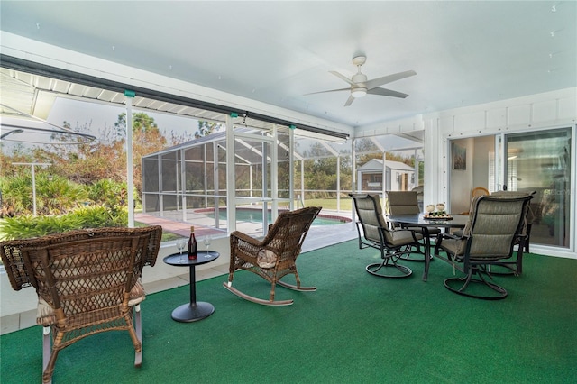 sunroom / solarium with ceiling fan