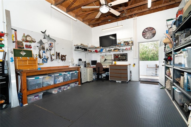 miscellaneous room with a workshop area and ceiling fan