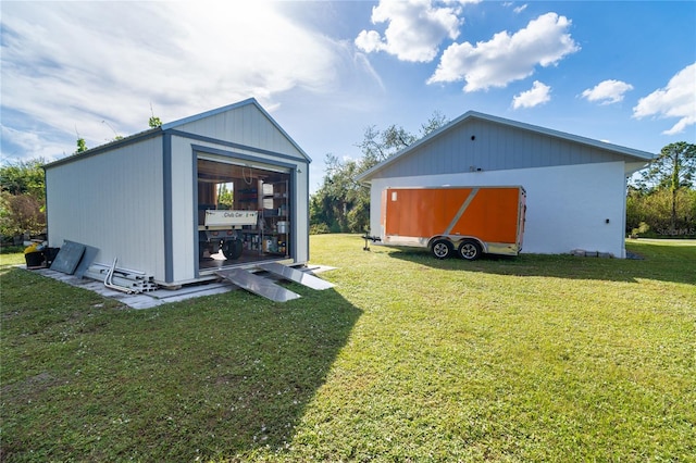 exterior space featuring an outbuilding and a lawn