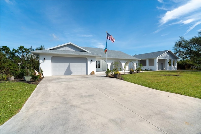 ranch-style house with a front lawn and a garage