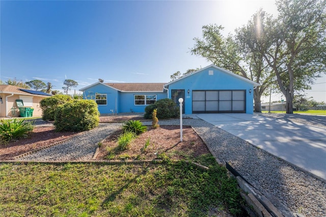 single story home featuring a garage