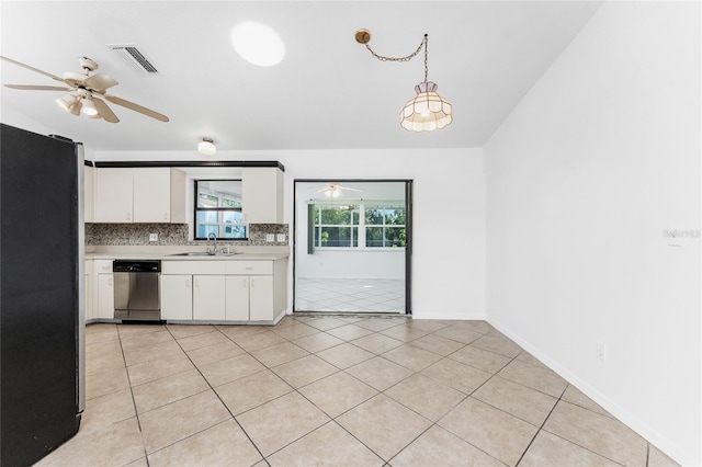 kitchen featuring white cabinetry, dishwasher, backsplash, decorative light fixtures, and fridge