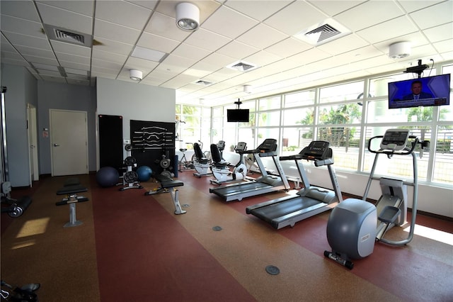 workout area with a paneled ceiling