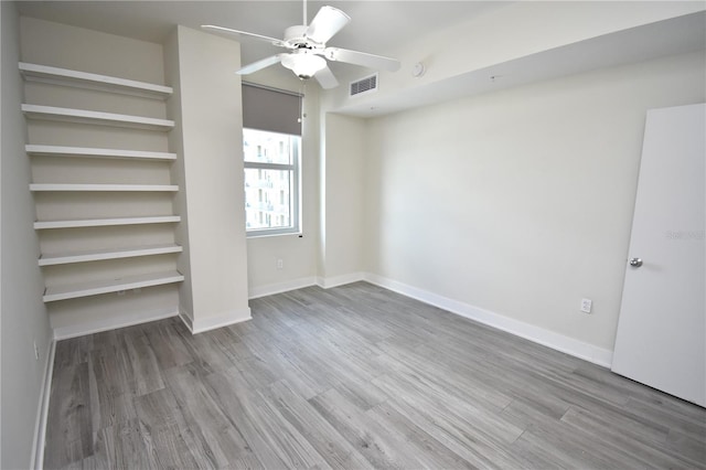 unfurnished bedroom featuring ceiling fan and wood-type flooring