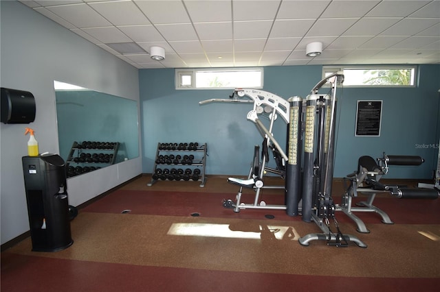 gym with dark colored carpet