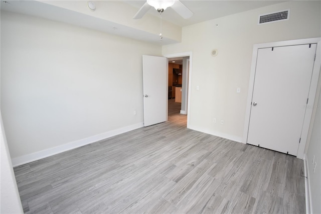 unfurnished bedroom with light hardwood / wood-style flooring and ceiling fan