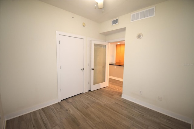 unfurnished bedroom featuring ceiling fan and hardwood / wood-style floors