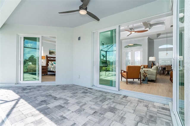 view of patio / terrace featuring ceiling fan and french doors