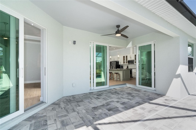 view of patio / terrace with ceiling fan