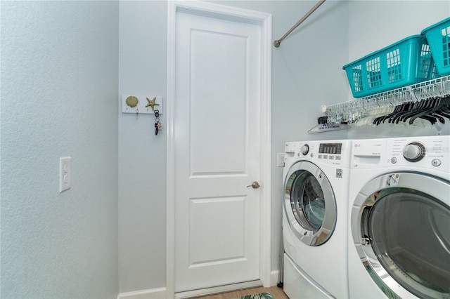 laundry room featuring separate washer and dryer