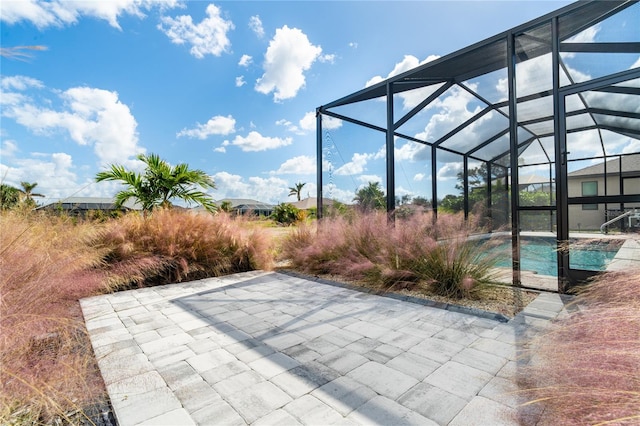 view of patio / terrace with glass enclosure