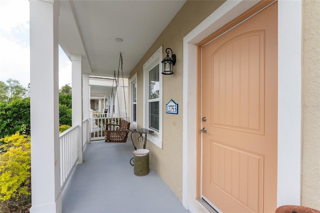 doorway to property featuring a porch