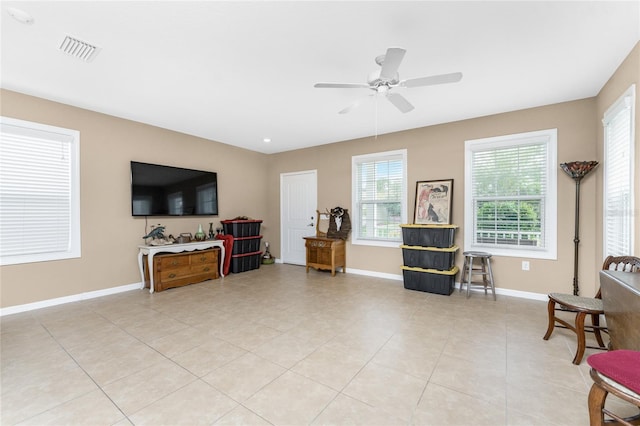 sitting room featuring ceiling fan and light tile patterned floors