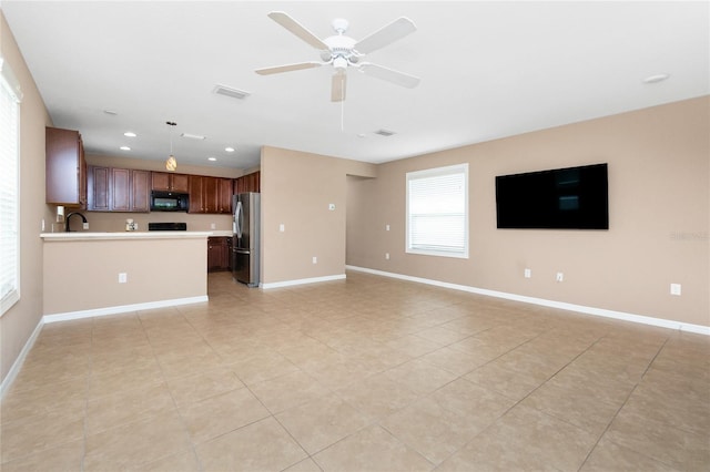 12753 Sagewood Dr, Venice, FL 34293 - unfurnished living room featuring light tile patterned floors, a ceiling fan, and recessed lighting