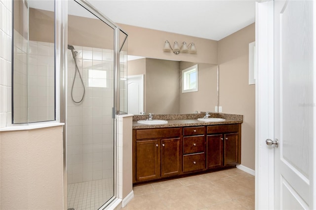12753 Sagewood Dr, Venice, FL 34293 - bathroom with a shower stall, double vanity, and tile patterned flooring
