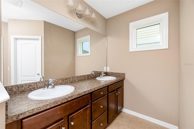 12753 Sagewood Dr, Venice, FL 34293 - bathroom with double vanity and tile patterned flooring