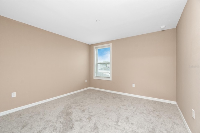 12753 Sagewood Dr, Venice, FL 34293 - carpeted empty room with baseboards