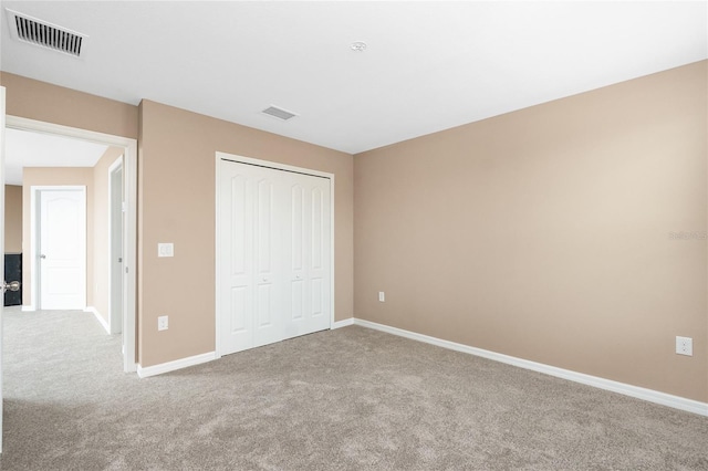 12753 Sagewood Dr, Venice, FL 34293 - unfurnished bedroom featuring carpet flooring and a closet