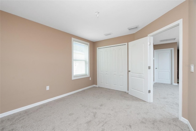 12753 Sagewood Dr, Venice, FL 34293 - unfurnished bedroom featuring carpet floors and a closet