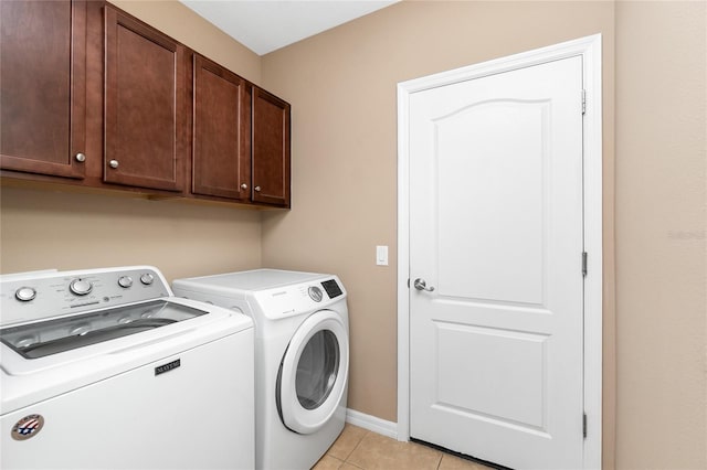 12753 Sagewood Dr, Venice, FL 34293 - laundry area with independent washer and dryer, cabinet space, and light tile patterned flooring