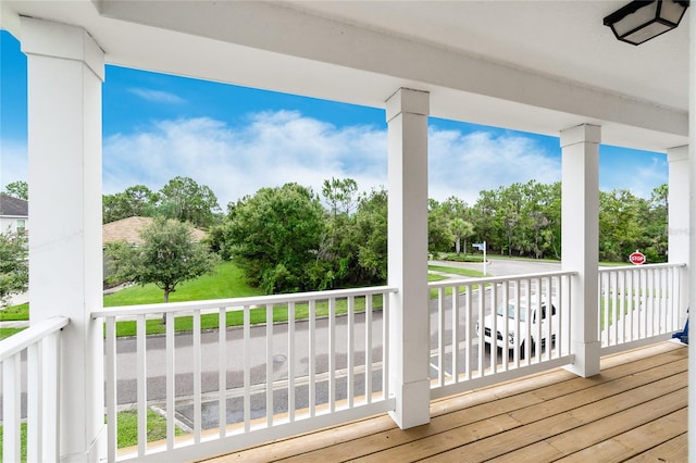 12753 Sagewood Dr, Venice, FL 34293 - porch featuring view of wooded area