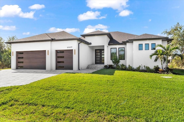 prairie-style house with a garage and a front yard