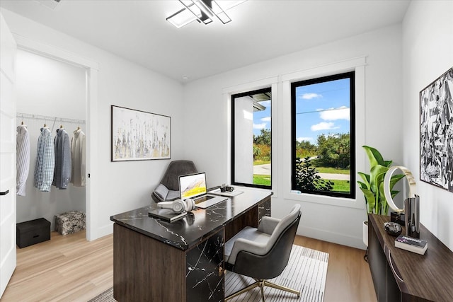 office with light wood-type flooring