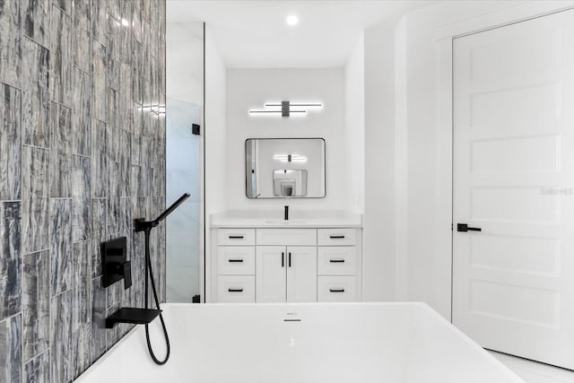 bathroom featuring a bathing tub and vanity