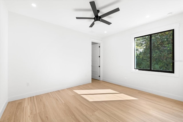 unfurnished room featuring ceiling fan and light wood-type flooring