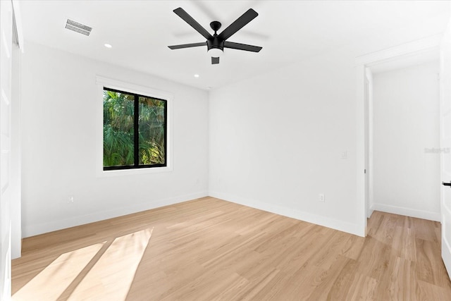 empty room with light wood-type flooring and ceiling fan